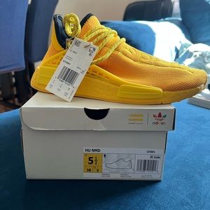 adidas
× Pharrell Hu NMD "Bold Gold/Yellow" sneakers. Size 5 1/2